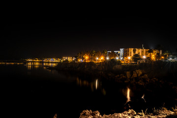long exposure city scape with reflection in the sea
