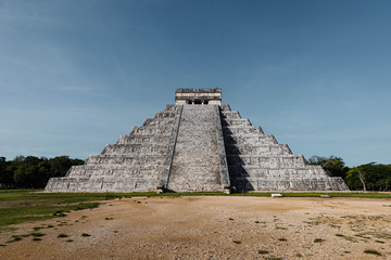 Fototapeta na wymiar Famous Maya Temple of Kukulcan (Chichen Itza) on Yucatan peninsula during sunrise with no tourists (Yucatan, Mexico, America)