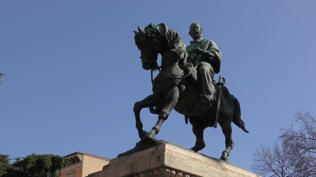 Verona, Italy. Monument to Giuseppe Garibaldi against the blue sky. Bright sunny winter day. Zoom out.	