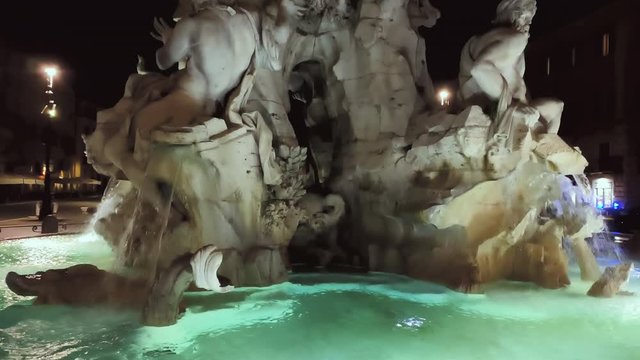water flowing in the Fountain of the Four Rivers in Piazza Navona in Rome