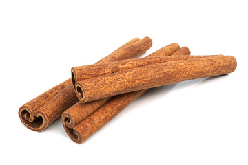 Cinnamon sticks isolated on white background closeup