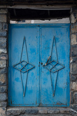 old rusty metal blue door
