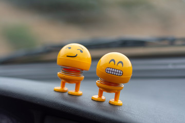 spring emoji toys on dashboard