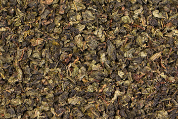 A green tea texture, background, pattern. Pile of green tea.