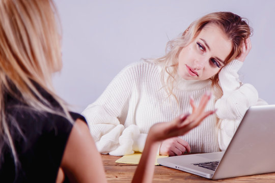 Sad And Skeptical Female Boss Interviewing Female Candidate For Job.