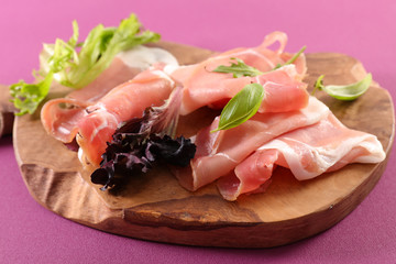 prosciutto ham on wooden board