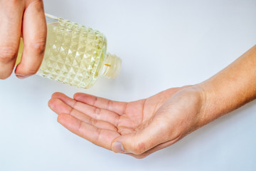 Obraz premium Use cologne alcohol for disinfection to viruses. Put cologne alcohol to clean hands.