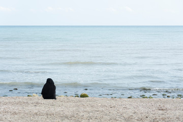 Muslim woman on the beach