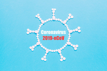 Fototapeta premium Virus concept made of pills on blue background. Epidemic of coronavirus (2019-nCov), dangerous pneumonia and quarantine.