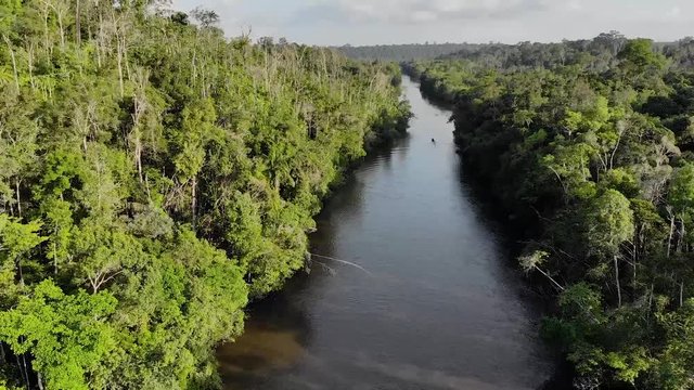 Drone shot of a fisherman on a canoe on Amazon river in Brazil