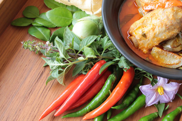 Thai food spicy pork spare rib red curry with crispy rice cake, homemade organic vegetable and herbs asian culinary.