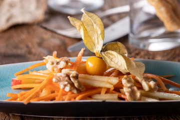 carrot and apple salad on wood