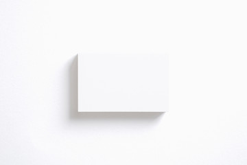 Blank business cards stack isolated on white. Template to showcase your presentation.