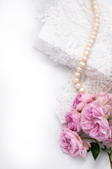 Bridal accessories with a pearl necklace and lace