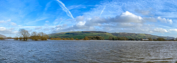 Panoramic view of farmland under water as a result of the River Severn bursting its banks after...