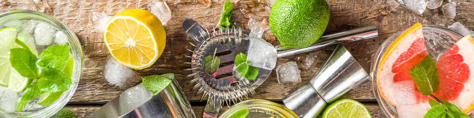 Summer detox beverage  concept. Citrus fruit drinks with ice. Healthy diet cocktail with making bar...