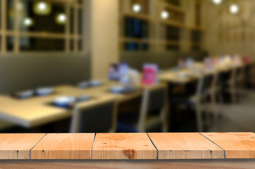 empty wooden table on blurred  restaurant background
