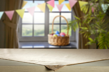 Desk of free space for your decoration and blurred window sith spring decoration. 