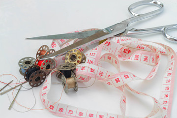 Sewing equipment, tape measure, thread, scissors
