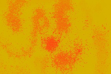 Abstract yellow mustard background with orange powder spots