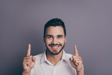 Closeup photo of handsome business guy sales man indicating fingers up empty space advising novelty...