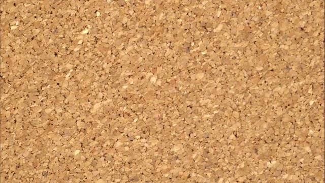 cork board background stop motion texture, 4k video footage.