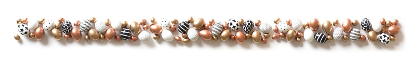 Top view of multi-colored large and small eggs. Nordic style