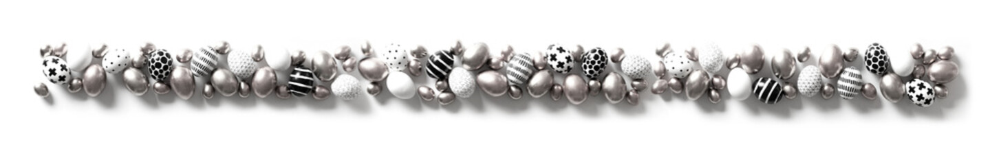 Top view of grey, black and white large and small eggs. Nordic style