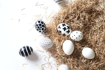 Close-up beautiful eggs of different sizes. Nordic style