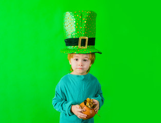 Patrick's Day. Green top hat. Boy in green hat holds pot with gold. Leprechaun. Green leprechaun. Green hat with clover. Saint Patrick's Day. Traditions of Saint Patrick Day. Sale. Discount. March.