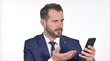 Portrait of Sad Young Businessman getting Loss on Smartphone, White Background