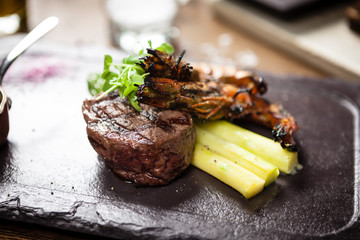 Tasting menu. Beef steak and grilled tiger prawns.
