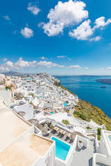 Fototapeta na wymiar Wonderful scenery of white architecture and blue sea view of Santorini island. Picturesque spring sunrise on the famous Greek resort Thira, Greece, Europe. Traveling concept background.