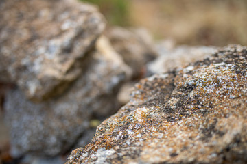 Natural closeup view of rock texture as stone wall brick, wall tiles made of natural stones