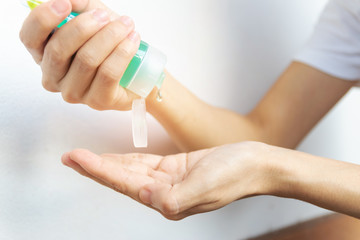 Washing hands with alcohol gel or anti bacteria soap sanitizer to make cleaning and clear bacteria. Hygiene concept.