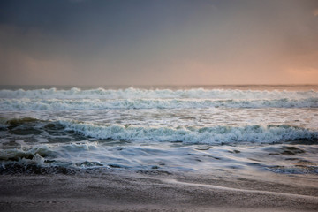 green ocean with soft sunrise