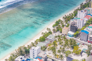 Male City, Maldives. Maldivian capital and local island from above. Hulhumale island with houses...