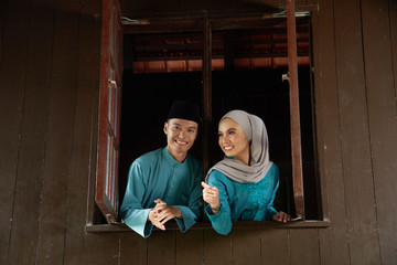 couple at the wooden window