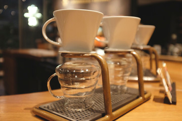 Coffee drip set on wooden table. Close up