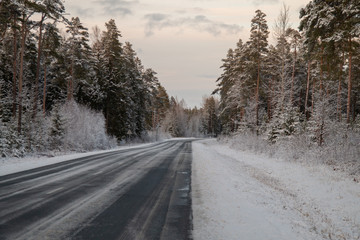 Fototapeta na wymiar Winter road in snowy winter day