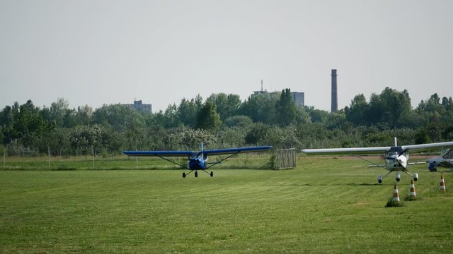 Ultralight small private aircraft airplanes take off on the airfield. Aviation festival holiday at the aerodrome airport 