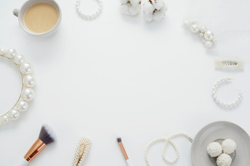 The wedding background with space for text, decorated with invitation envelopes and decorations for the bride, is made in soft pastel colors, with copy space. Conceptual backgrounds for wedding texts.