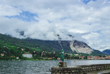 Beautiful sculpture on the promenade of the island of Dei Pescatori. lago maggiore. Italy. Soft focus blurred background.