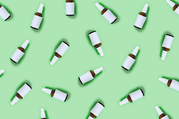 Zero waste concept. Craft tube, wooden tray, natural oil in the spray glass bottle, shaver, shaver brush on blue background. Flat lay, top view, copy space.