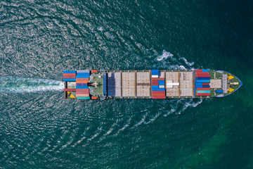 cargo ship sailing on the sea top view from drone