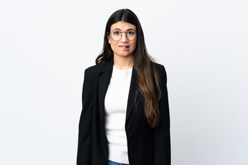 Business woman over isolated white background having doubts and with confuse face expression