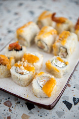 Japanese food. Sushi. Philadelphia roll with fresh salmon, cucumber, avocado, cream cheese, tobiko caviar. Sushi menu. Top view