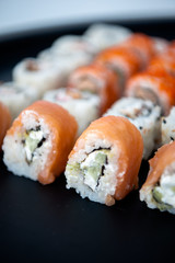 Japanese food. Sushi. Philadelphia roll with fresh salmon, cucumber, avocado, cream cheese, tobiko caviar. Sushi menu. Top view