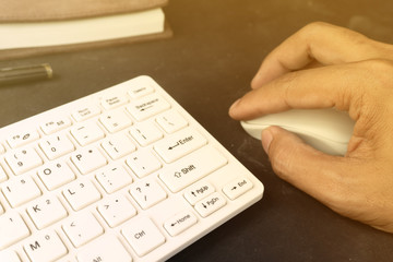 Businessman hand working with computer and mouse keyboard
