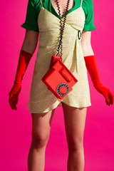 cropped view of pop art girl with retro phone, isolated on pink